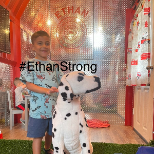 Ethan in his Make-A-Wish Fire Shed
